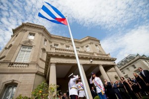 Cuban Foreign Minister Bruno Rodriguez raises the Cuban flag over the country's new embassy in Washington D.C. (AFP Photo/Andrew Harnik)