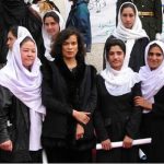 Reality Tour participant with women students in Afghanistan. - Photo by Zarah Patriana