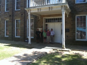 Creek Council House, downtown Okmulgee, OK. GX tour group pictured with Muscogee Nation Museums Director/Curator John Beaver and Assistant Director Justin Giles.
