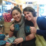Global Exchange Staff Jessica and Chelsea with Chelsea's new Le Souk dishware.